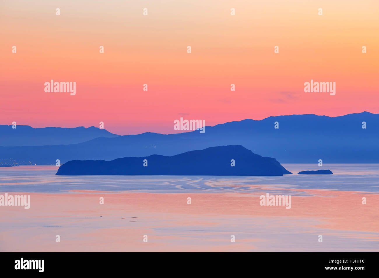 sunset over the mountain with reflection on the sea Stock Photo - Alamy