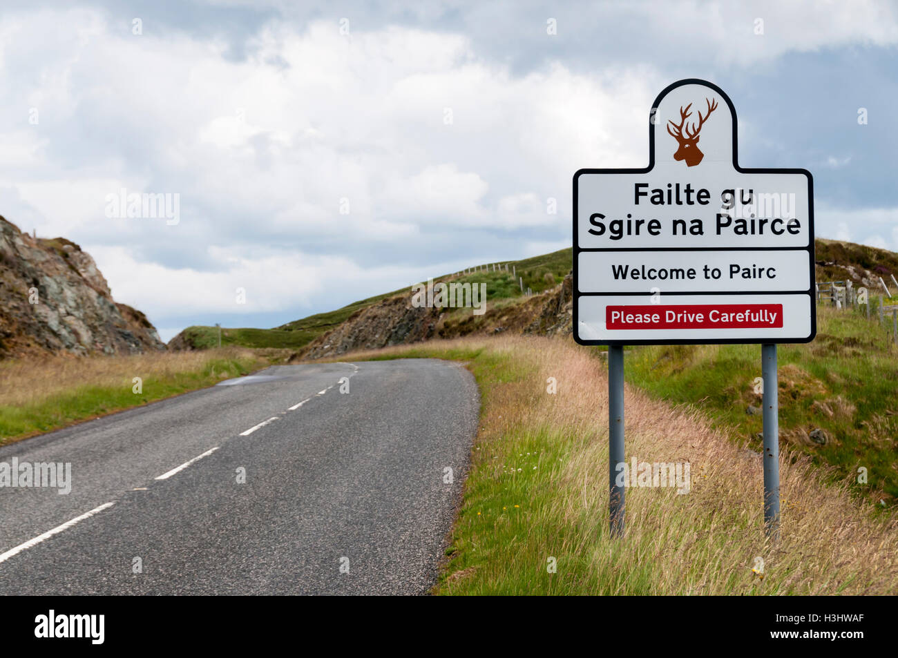 Welcome to Pairc in English and Gaelic and Please Drive Carefully sign on the Isle of Lewis in the Outer Hebrides. Stock Photo