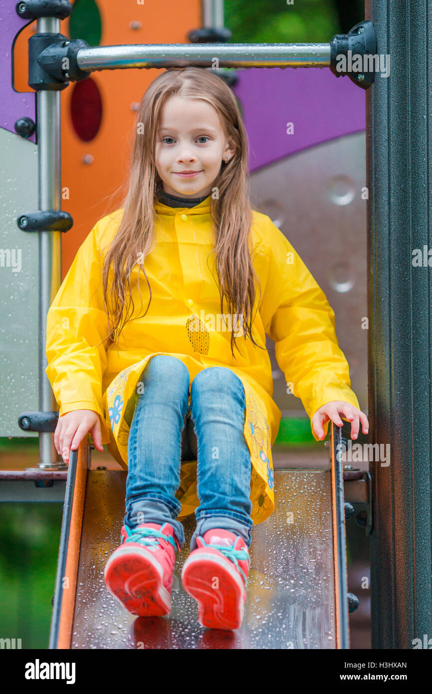 Adorable little girl playing on outdoor playground Stock Photo - Alamy