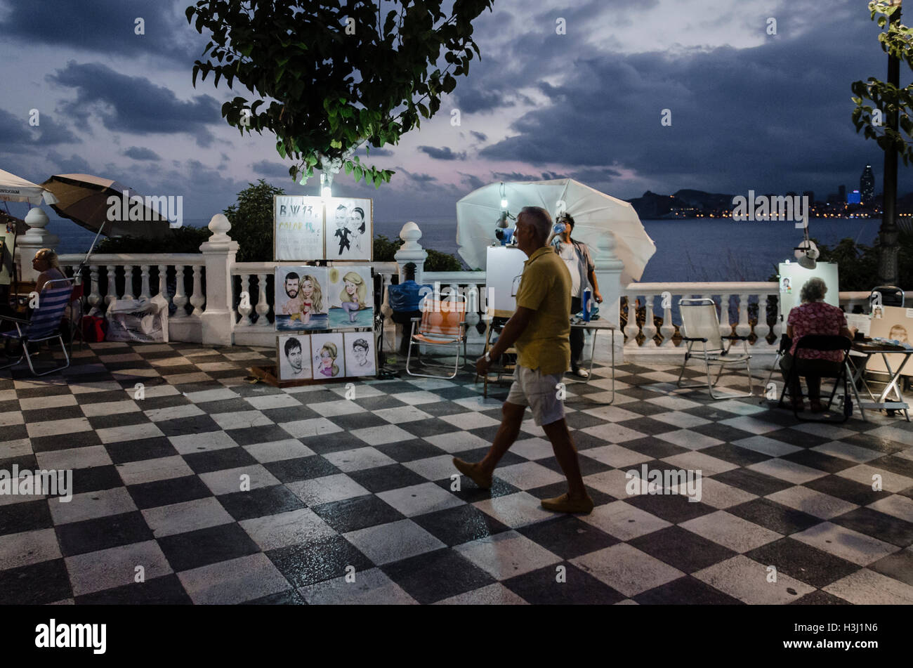 View of a walker in a street of Benidorm city, Alicante north, Spain Stock Photo