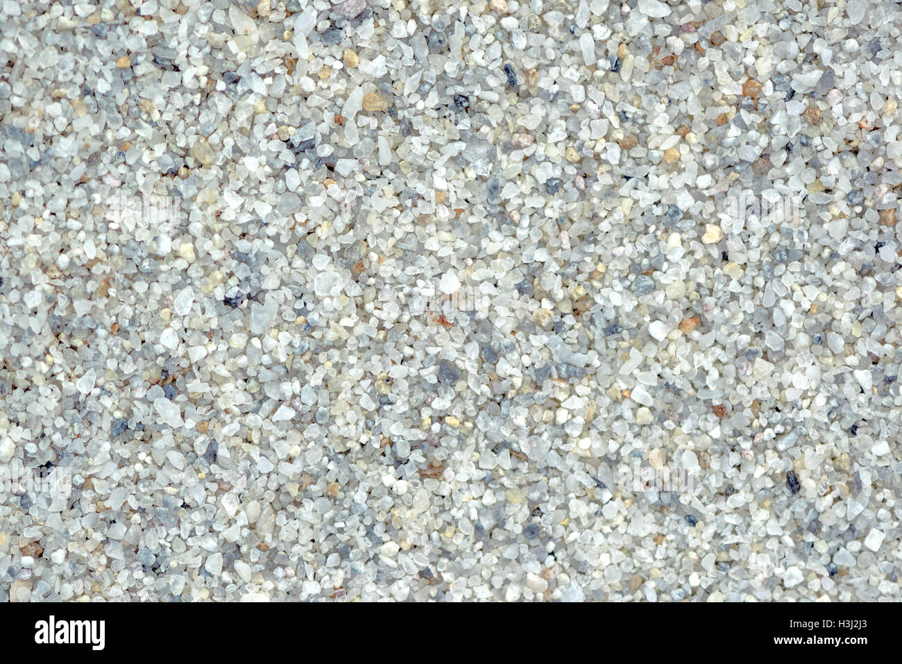 Quartz sand abstract texture as background, macro view of grainy surface Stock Photo