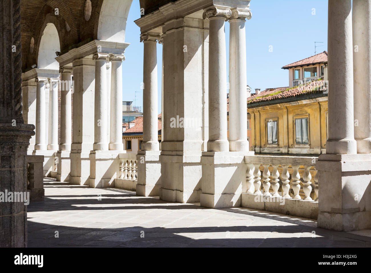 Vicenza,Italy-April 3,2015:view of  the  famous colonnade of the Palladian basilica in the center of Vicenza during a sunny day. Stock Photo