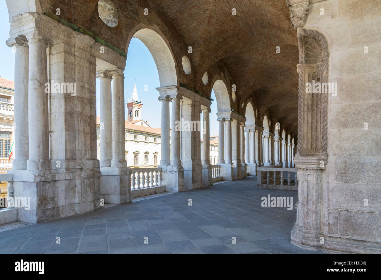 Vicenza,Italy-April 3,2015:view of  the  famous colonnade of the Palladian basilica in the center of Vicenza during a sunny day. Stock Photo