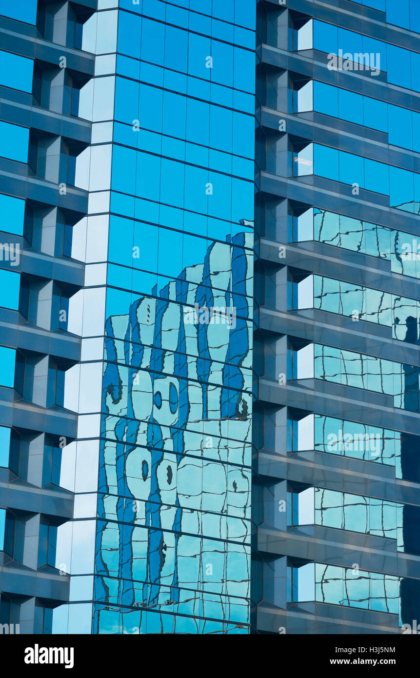architectural detail of office skyscraper blue glass exterior and reflections Stock Photo