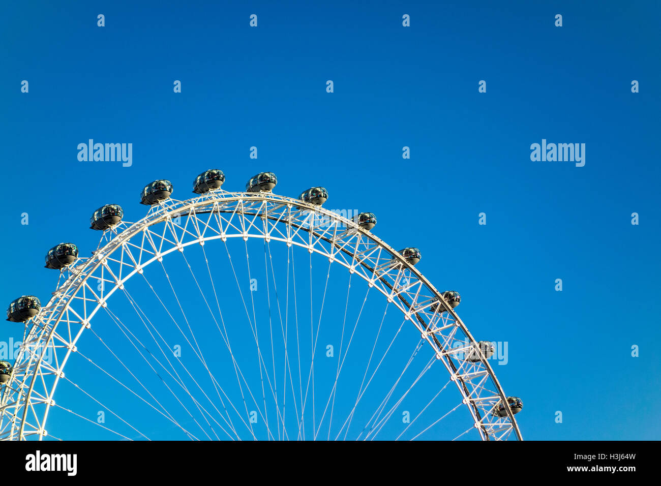 London Eye against a blue sky Stock Photo