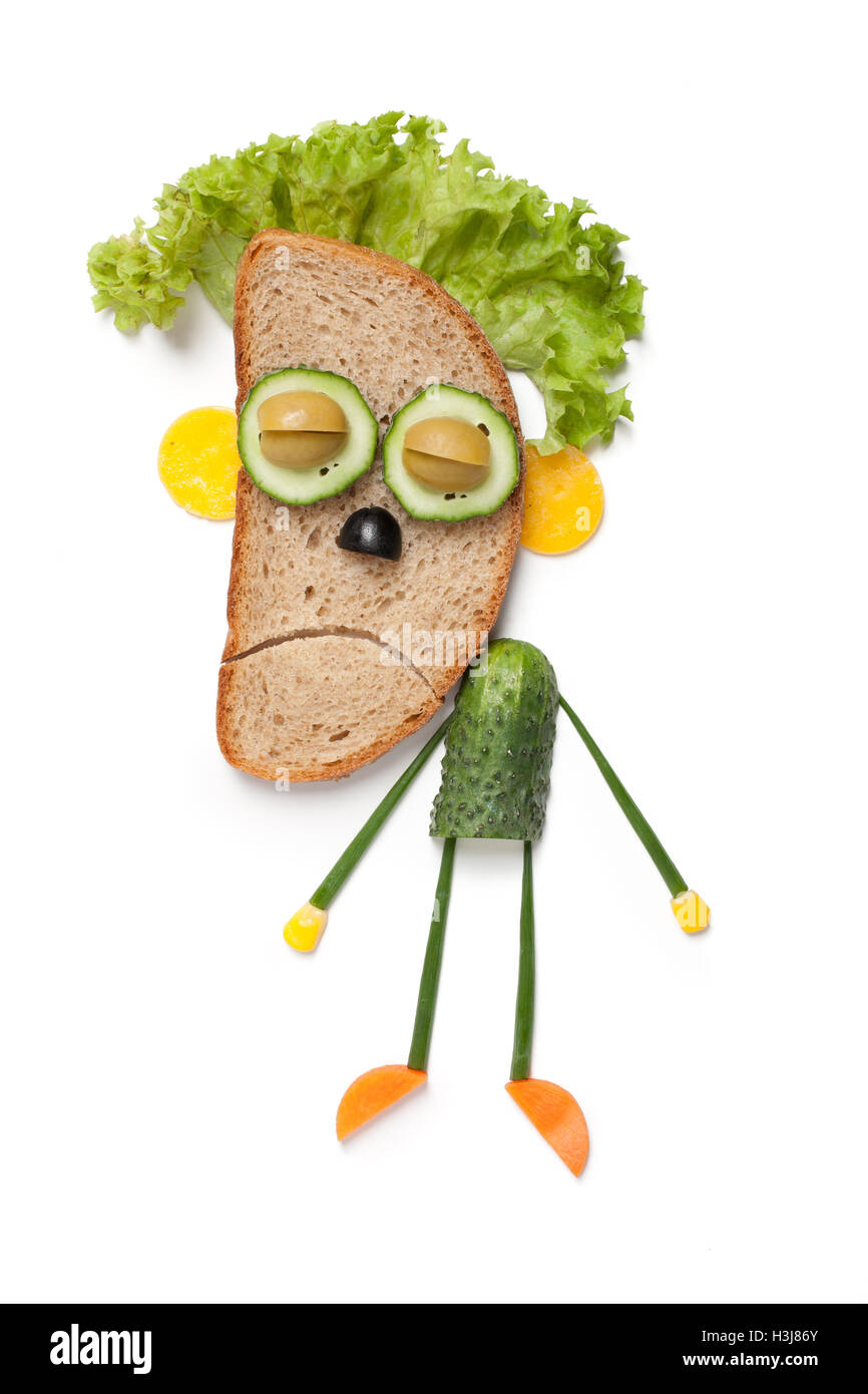 Halloween zombie made of bread and vegetables on white background Stock Photo