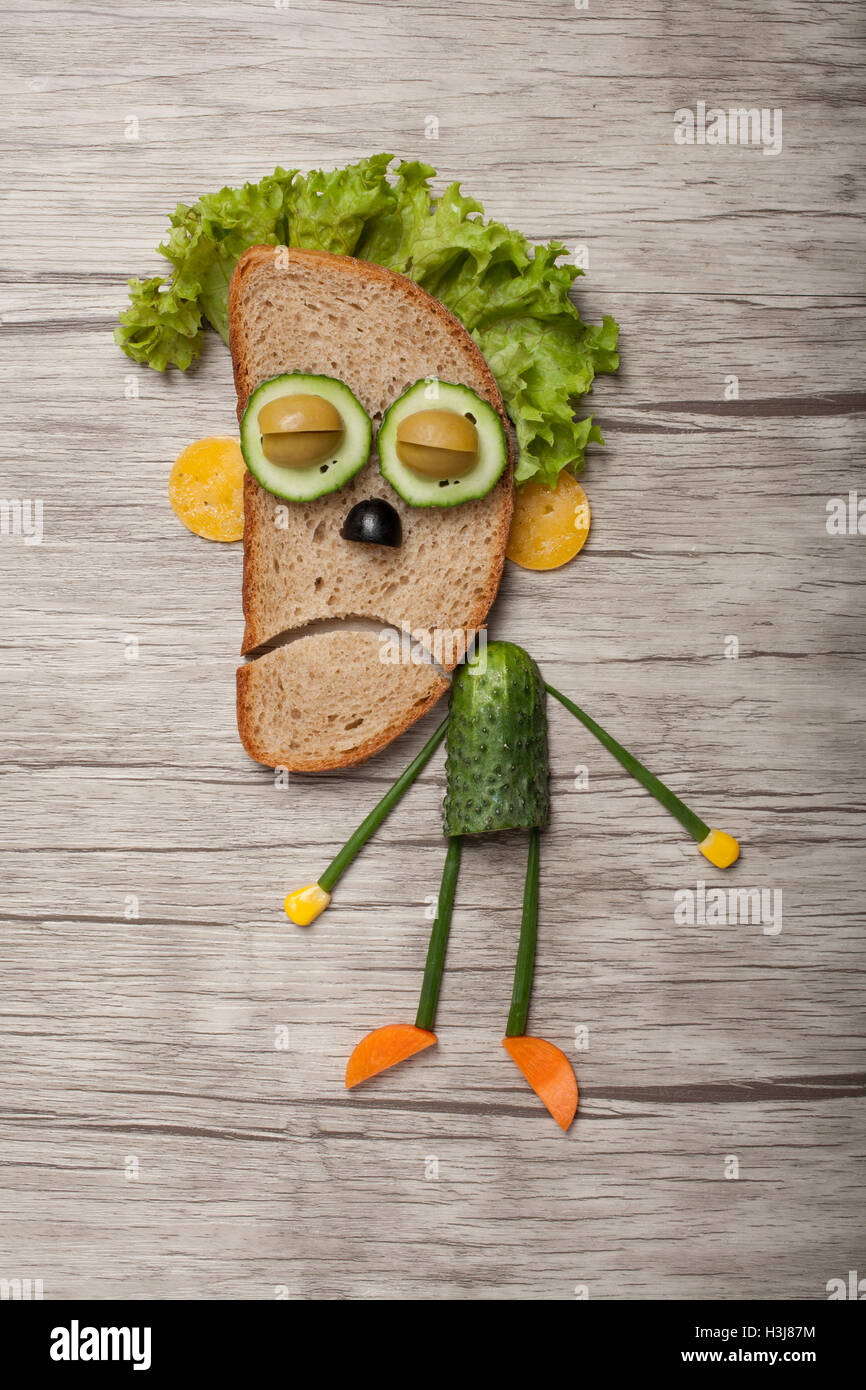 Halloween zombie made of bread vegetables on board Stock Photo Alamy