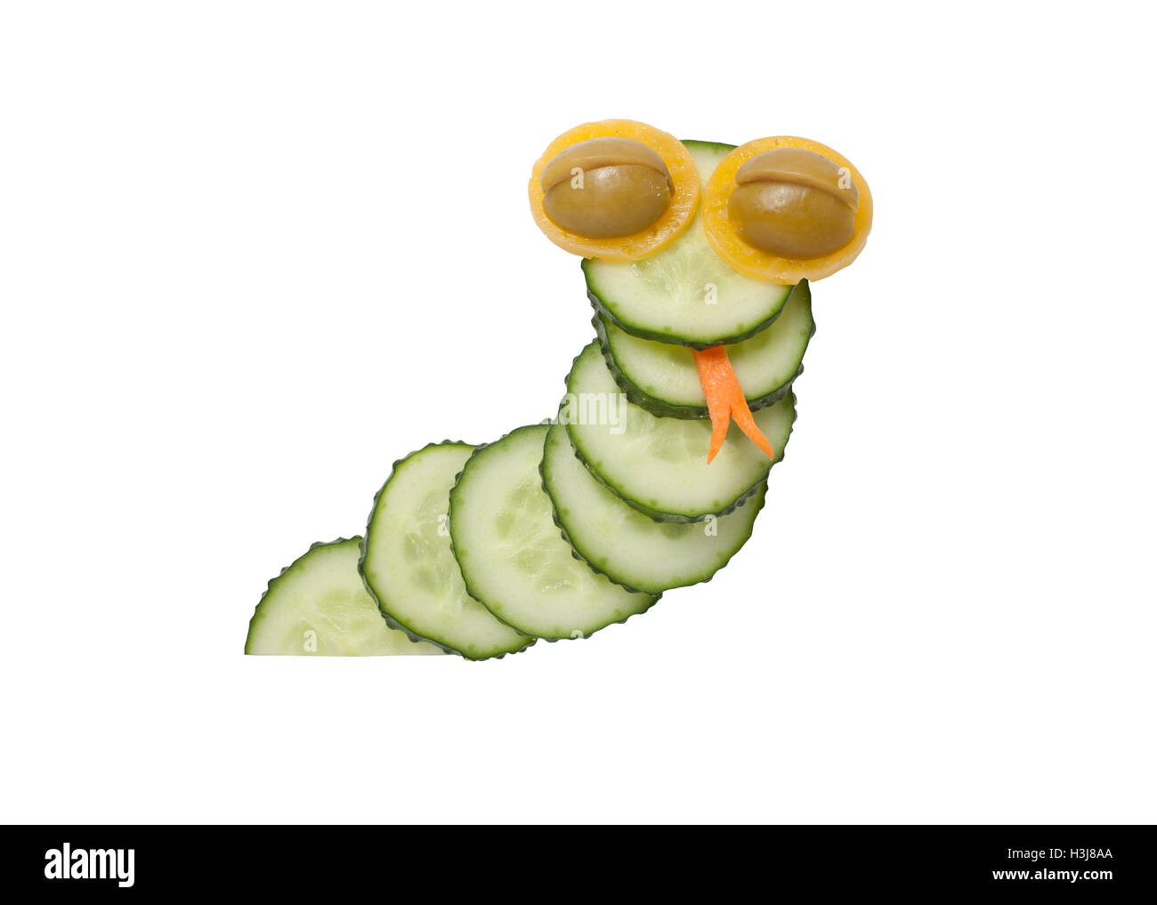 Funny snake made of cucumber on isolated background Stock Photo