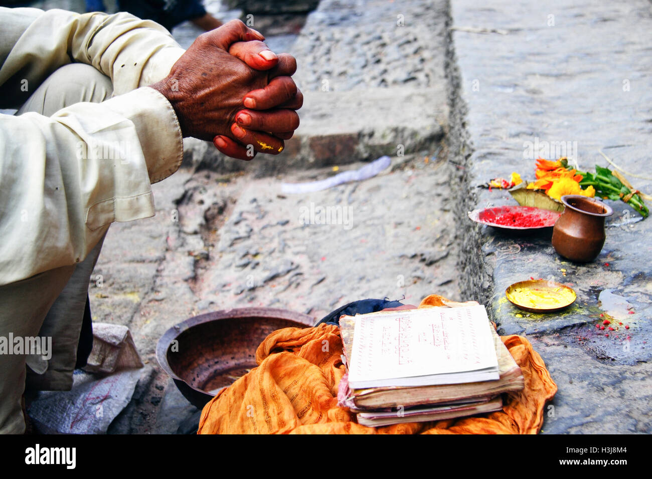 Close up of brahmin hands performing puja at Pashupatinath, one of the most sacred temples of Lord Shiva (Pashupati),located on Stock Photo