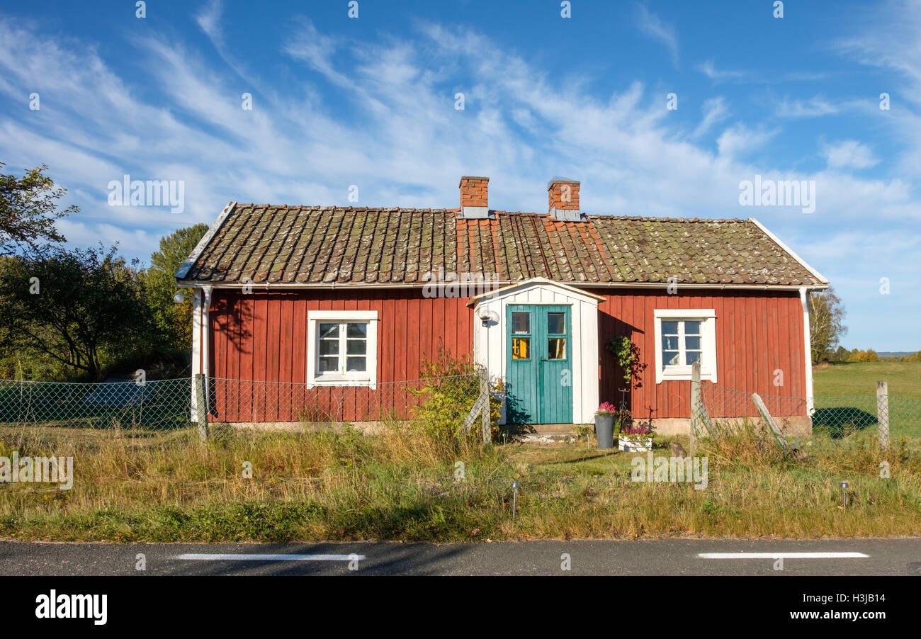 Red cottage in the countryside of Vastergotland, Sweden Stock Photo