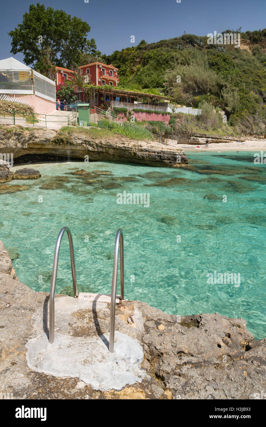 The rocks at Saint Thomas beach, Kefalonia, have steps into the beautiful turquoise sea. Stock Photo
