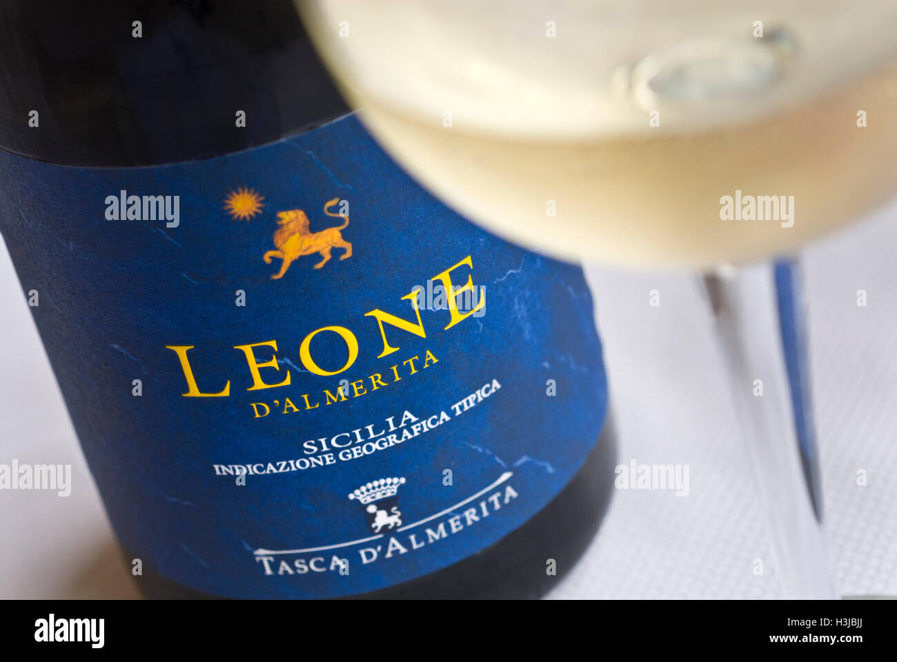 Bottle and glass of Leone white dry Sicilian wine Stock Photo Alamy