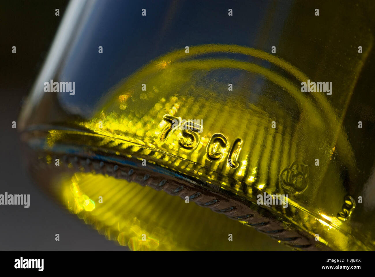 Close up on 75 cl capacity glass relief engraving on bottom of standard wine bottle Stock Photo