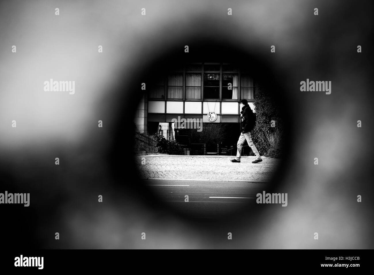 A view through a hole of the remaining Berlin Wall in Bernauer Strasse in the city. Stock Photo