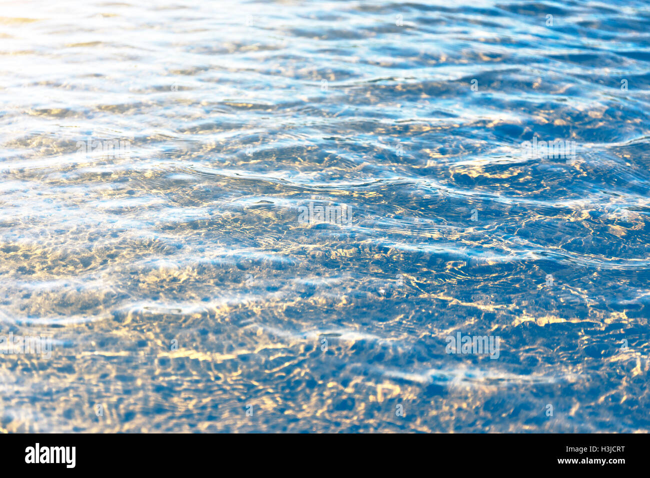 Water surface with reflections from the rays of sunlight Stock Photo ...