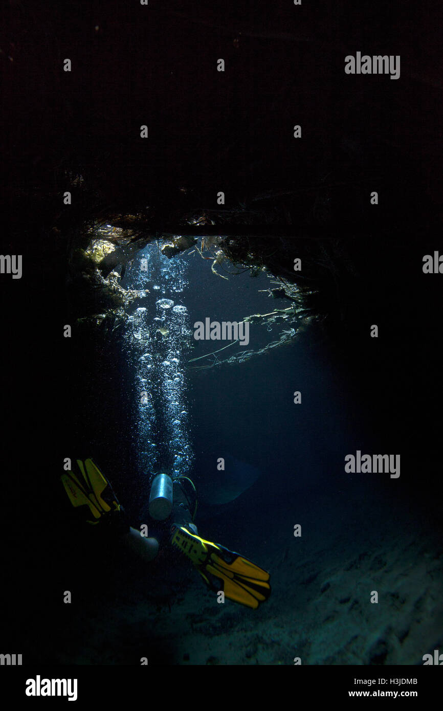 SCUBA diving the underwater cave in Media Luna freshwater lagoon near