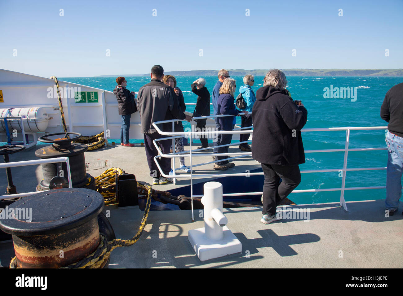 Sealink ferry passengers on front deck observing Kangaroo island as