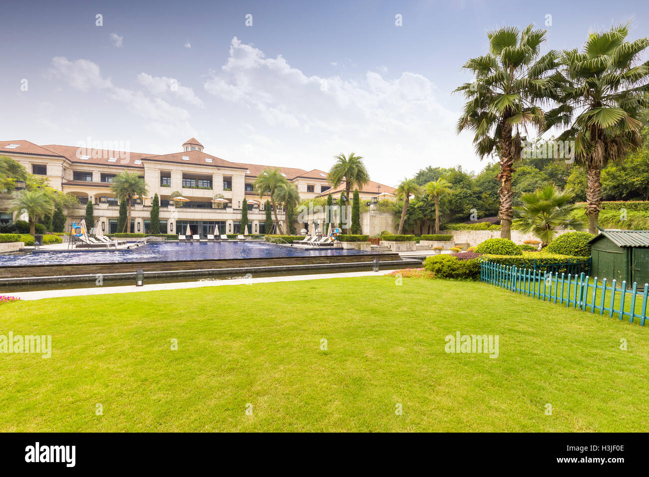 modern holiday hotel with beautiful meadow in sunny day Stock Photo
