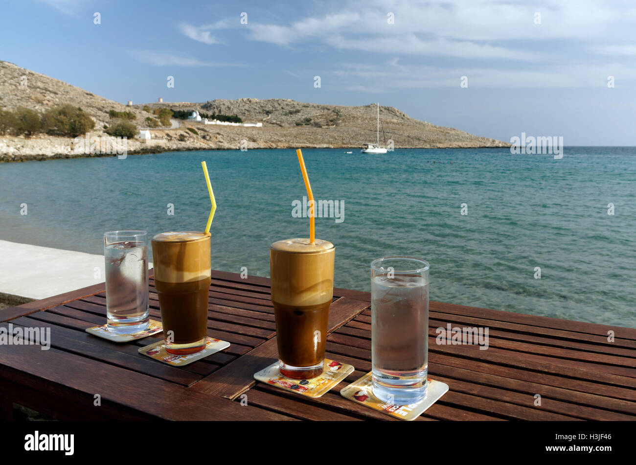 Frappé coffee drink, Pondamos or Pontamos Beach, Chalki Island near