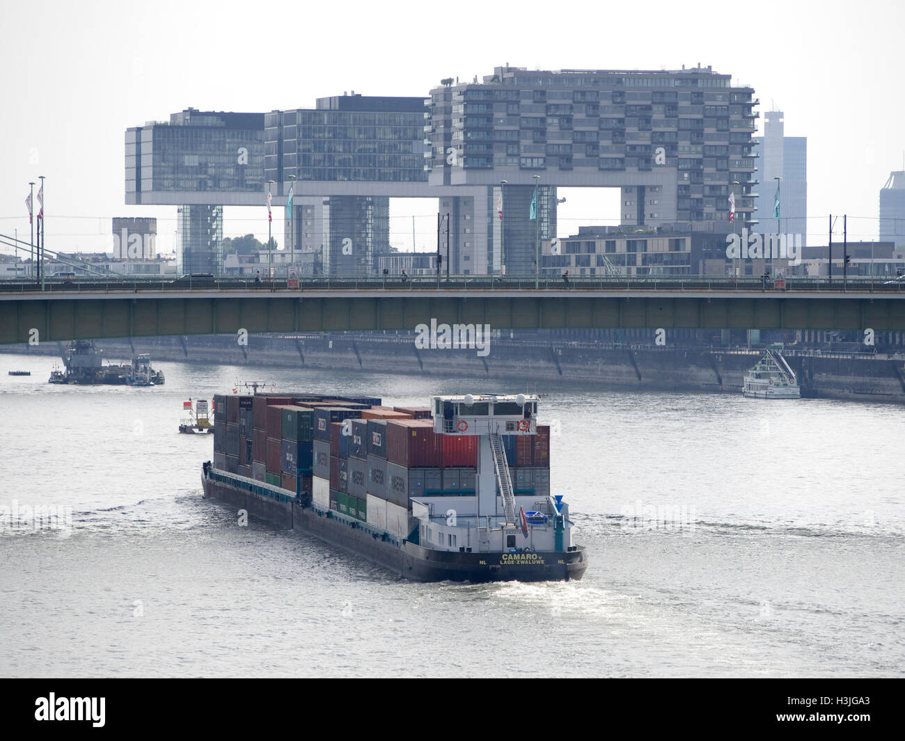 Container ship on the Rhine near the city center of Cologne, Germany Stock Photo