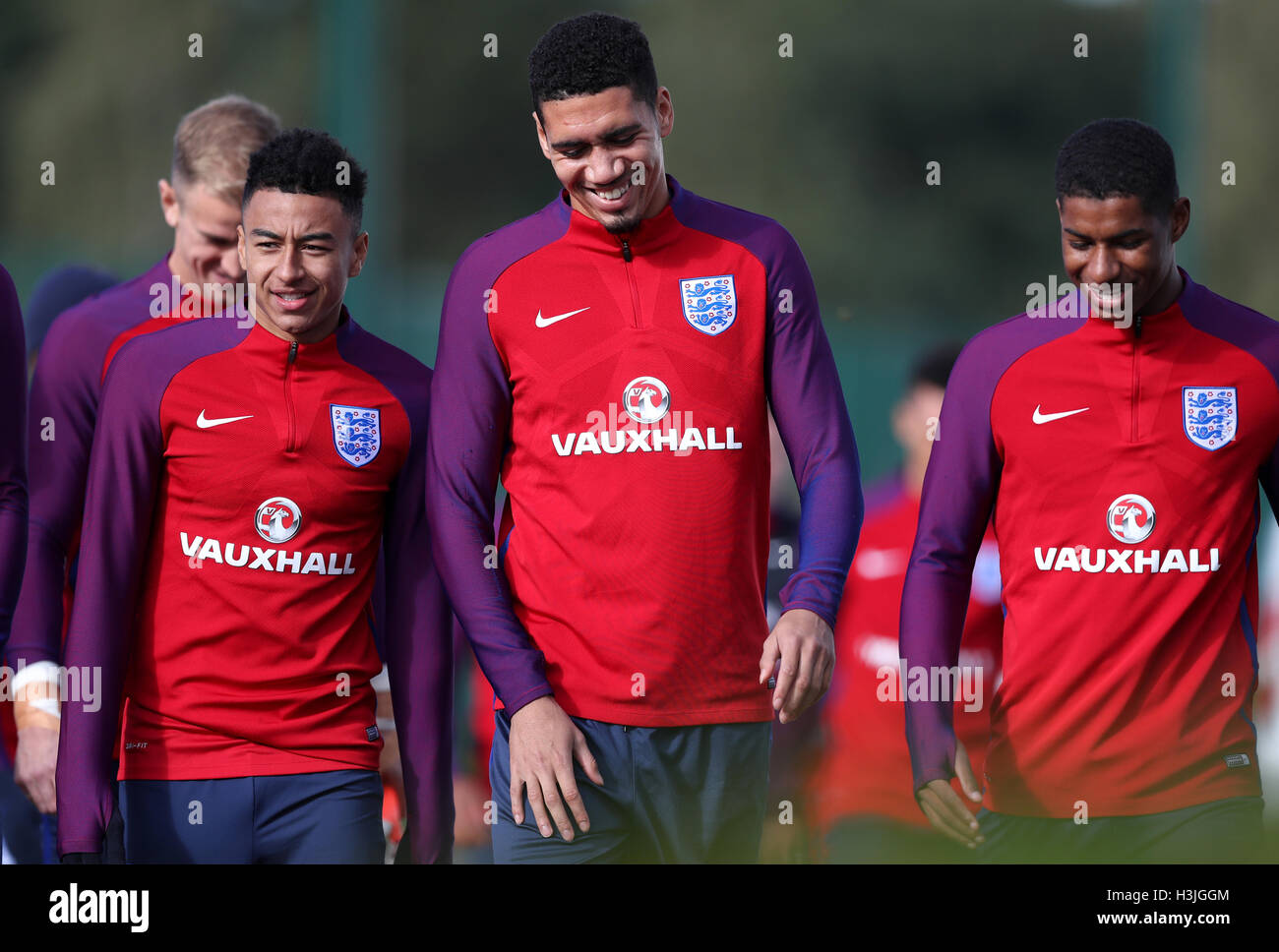England's Jesse Lingard (L - R) England's Chris Smalling and England's Marcus Rashford during a training session at Enfield Training Ground, London. Stock Photo