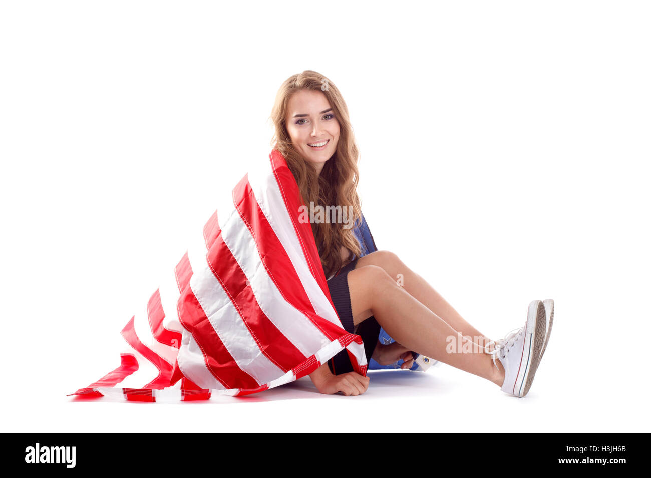 Happy young woman holding USA flag. Image isolated on a white ...