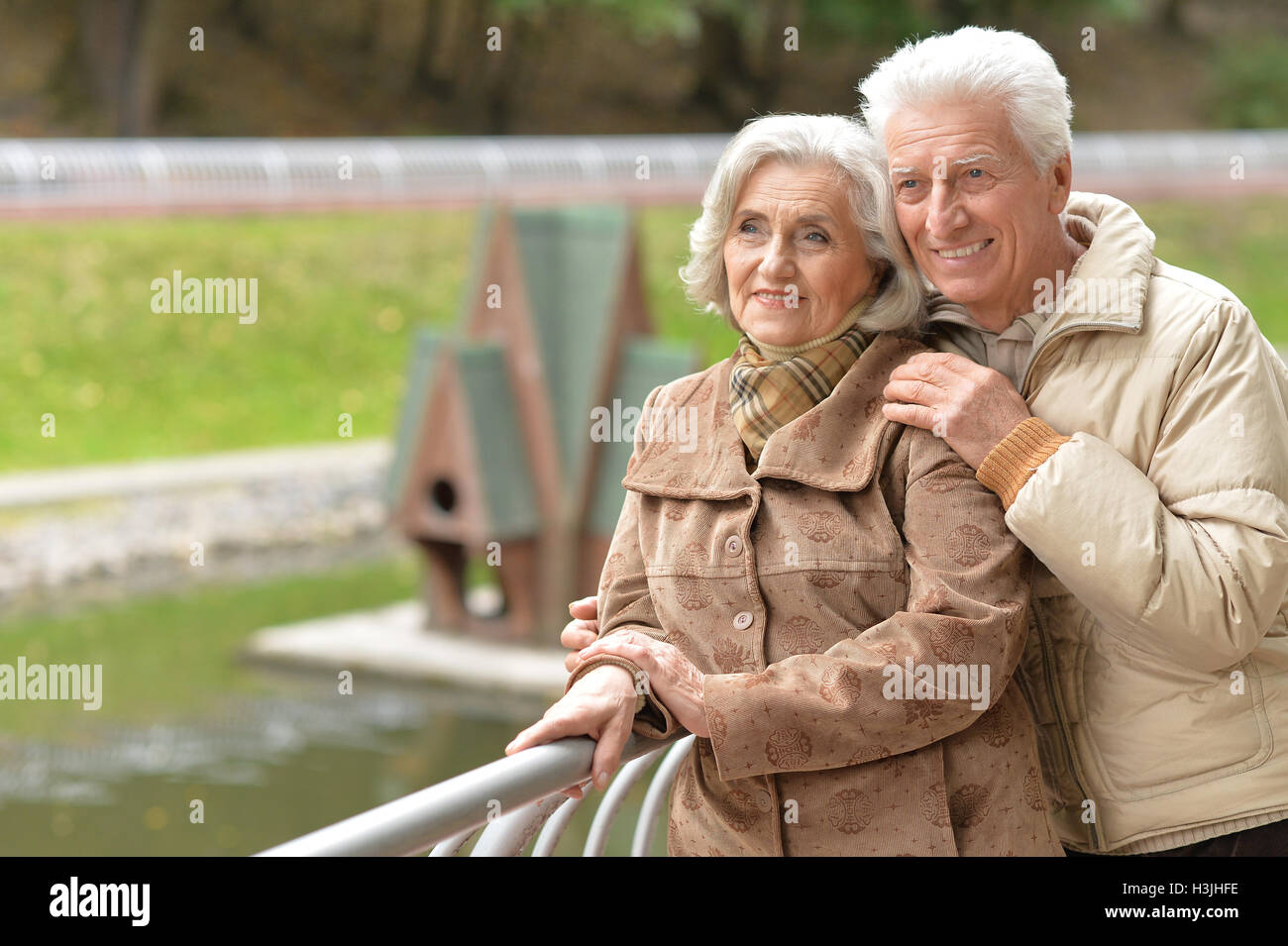 Beautiful lderly couple walking in the autumn park Stock Photo - Alamy