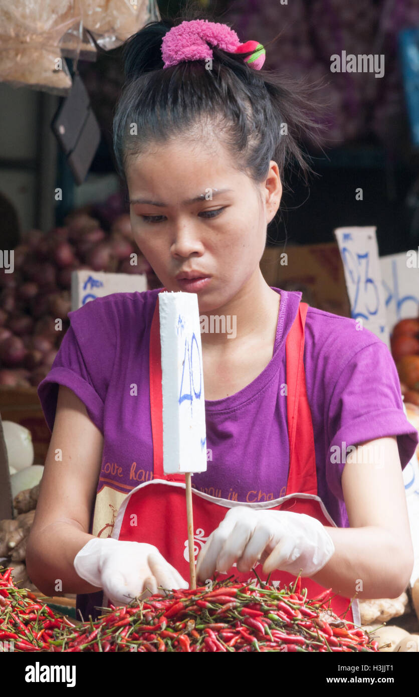 Woman selling chillies hi-res stock photography and images - Alamy