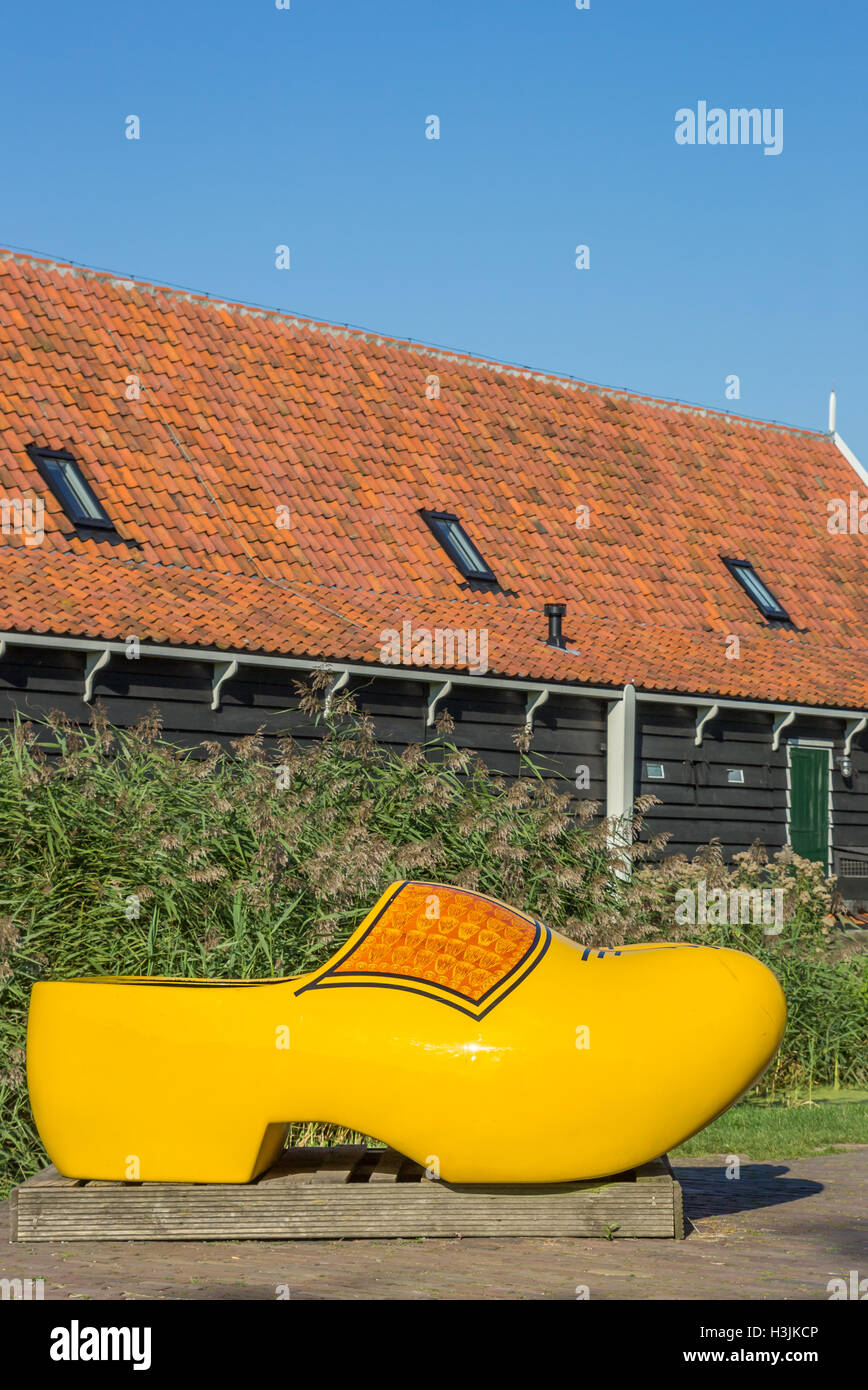 Large yellow wooden shoe in Zaanse Schans, Holland Stock Photo