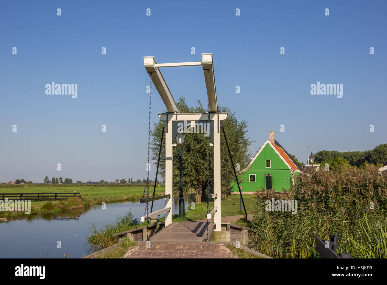 Little white bridge and small wooden house in Zaanse Schans, Holland Stock Photo