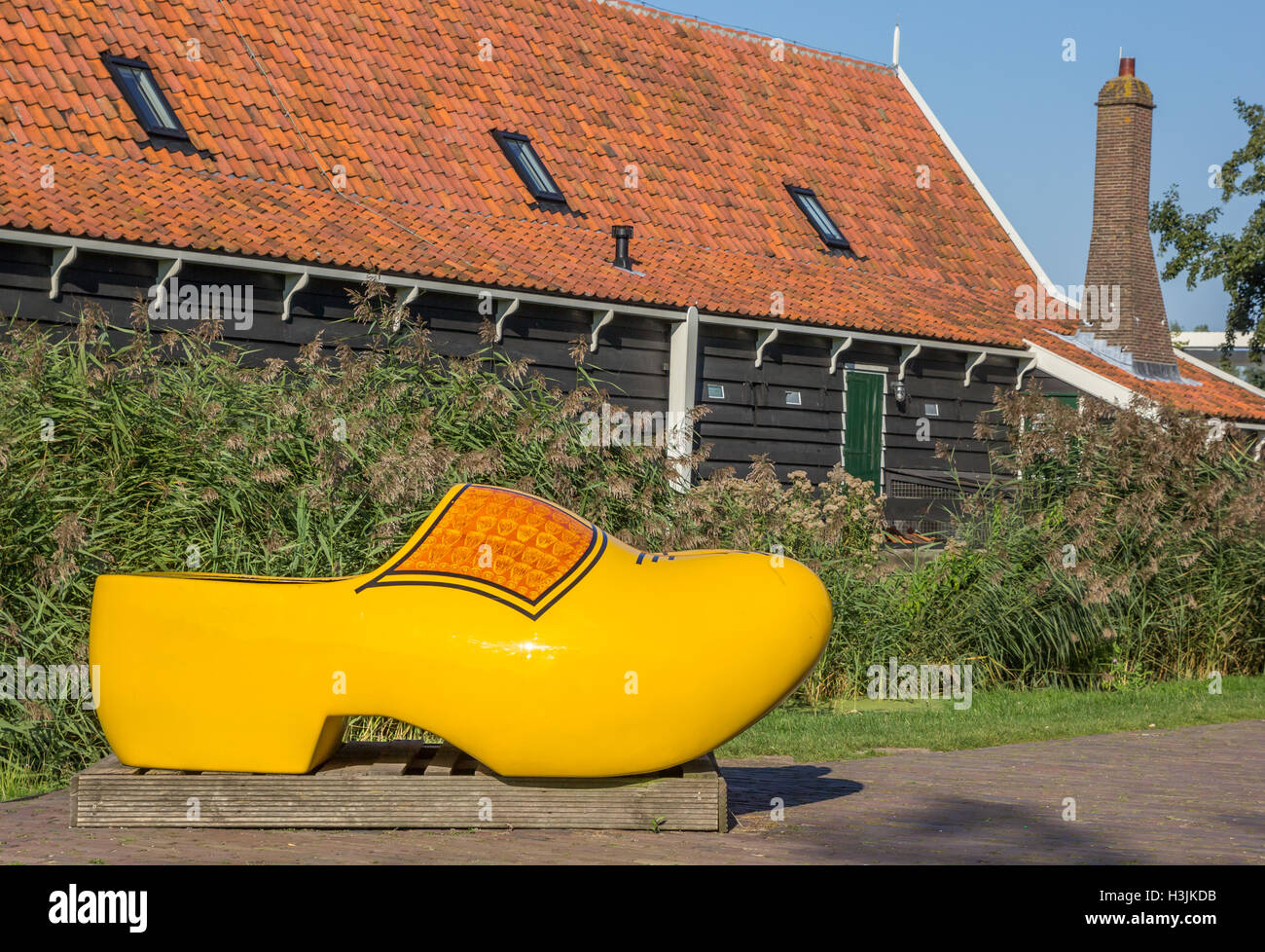 Large yellow wooden shoe in Zaanse Schans, Holland Stock Photo