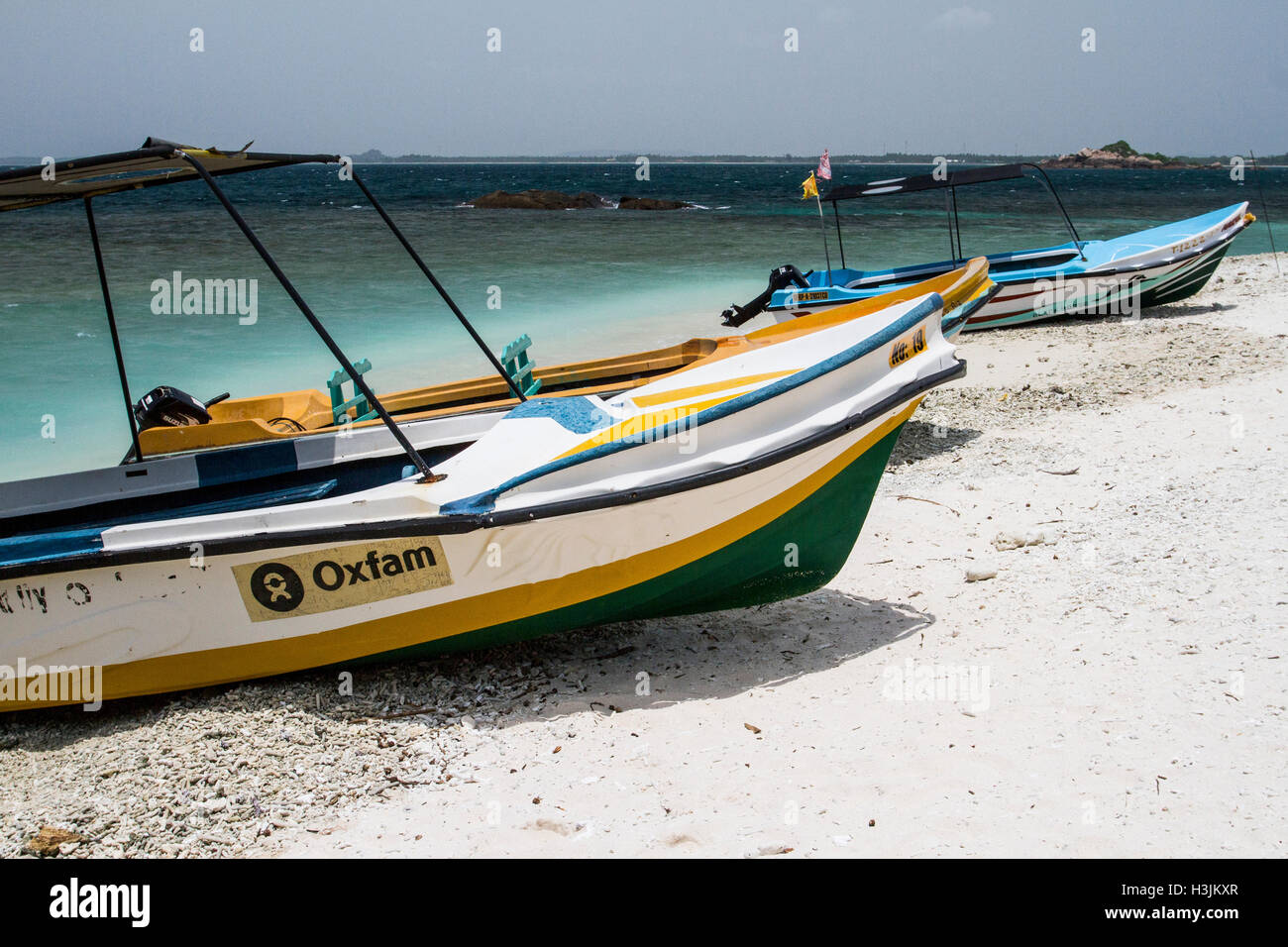 Tourist boats on the shore of Pigeon Island, Sri Lanka Stock Photo