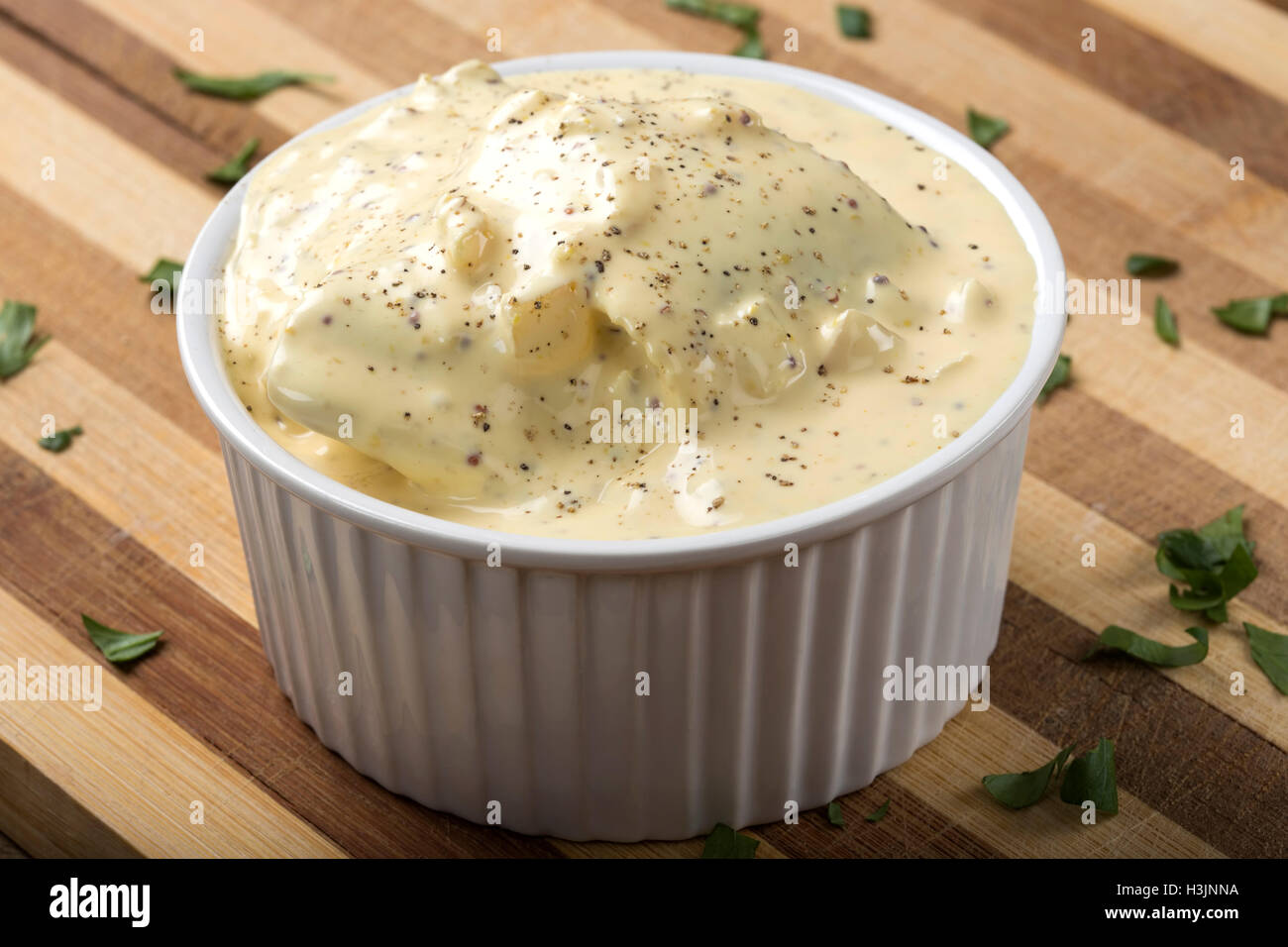 Bowl with herring fillets in mustard sauce Stock Photo Alamy
