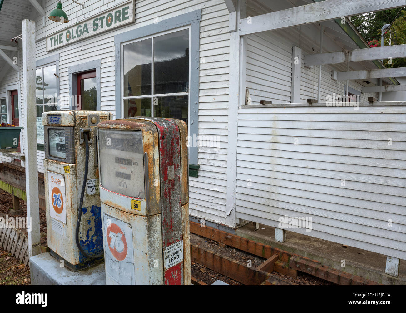 USA, Washington, San Juan Islands, Orcas Island, Old gas pumps and front of historic Olga Store in Olga Washington. Stock Photo