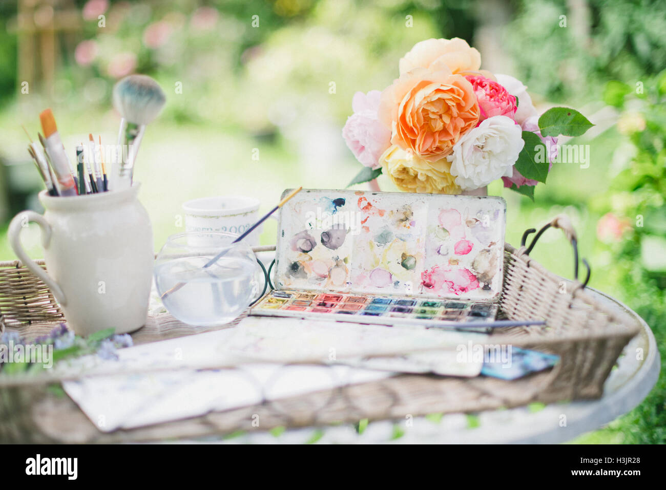 Artist paint palette in an English cottage garden Stock Photo Alamy