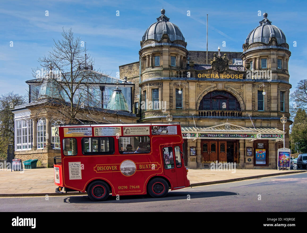 A converted Victorian Tour Tram Outside the Buxton Opera House, Buxton, Derbyshire, England, UK Stock Photo