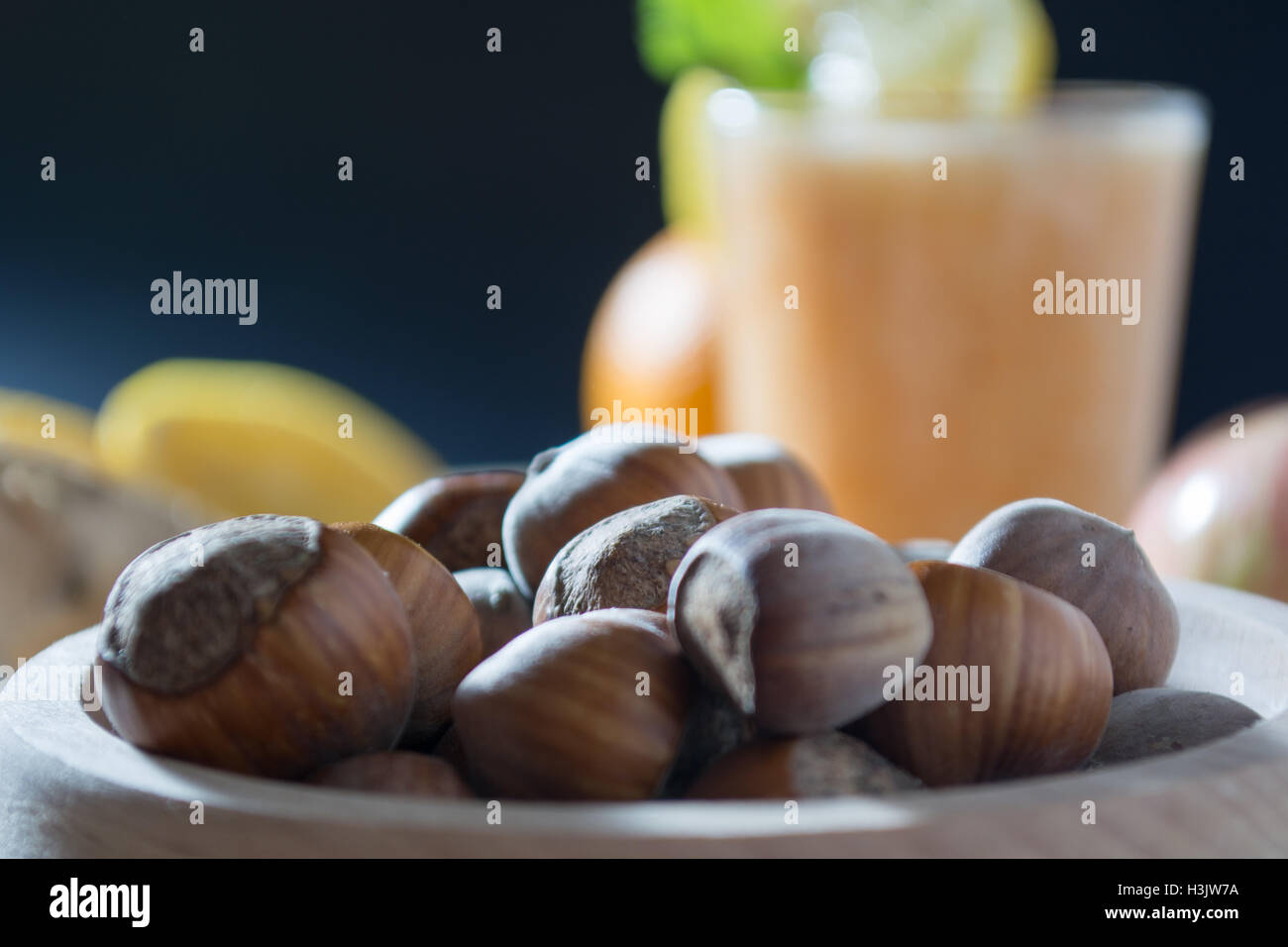 Hazelnuts in wooden bowl ready to be cracked and eaten Stock Photo Alamy