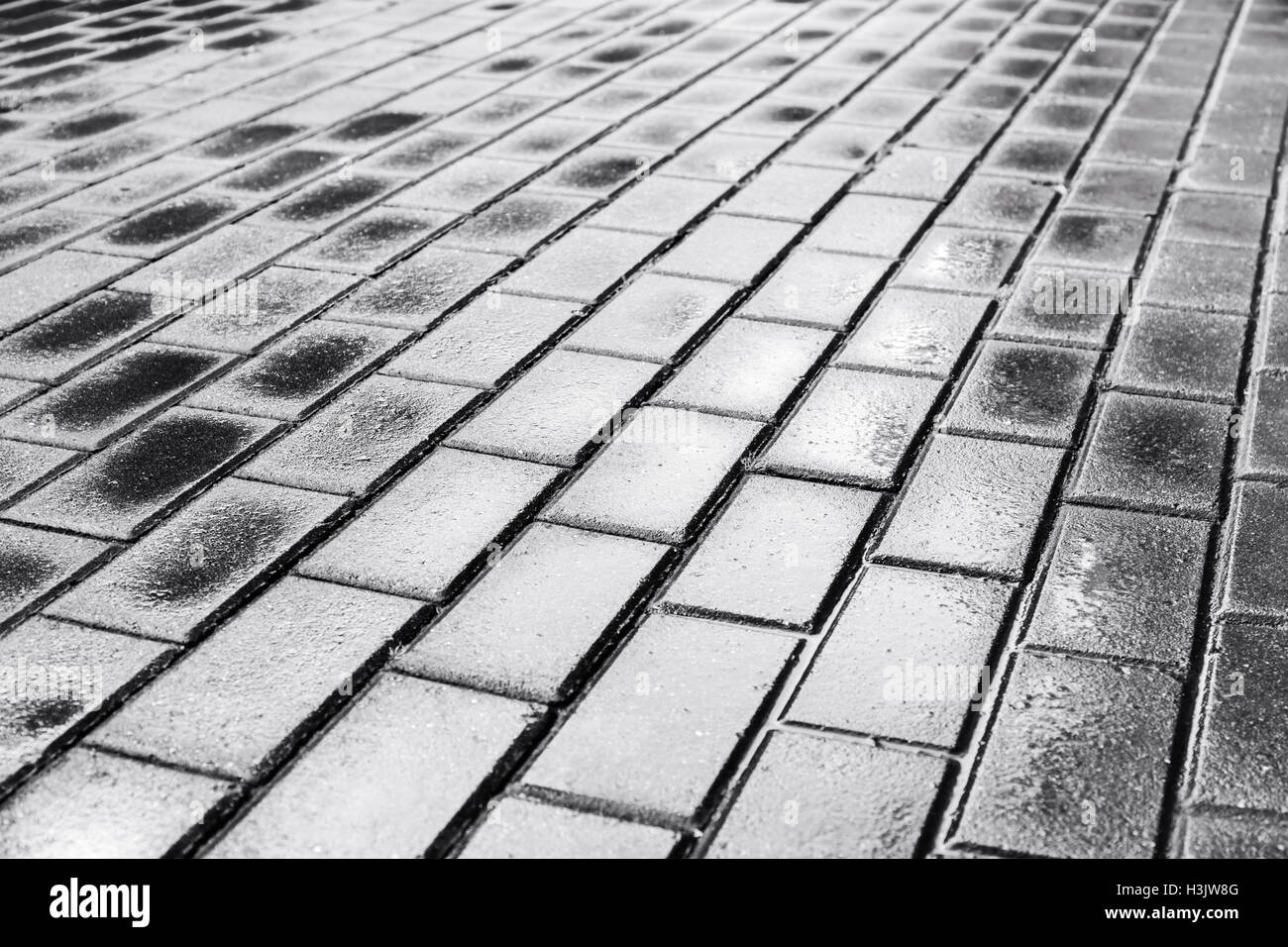 dark wet concrete urban pavement after heavy rain Stock Photo