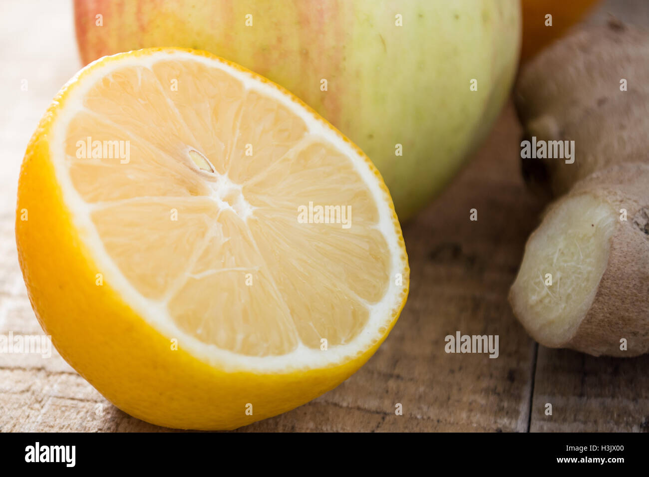 Juicy fruits and ginger on a table Stock Photo Alamy