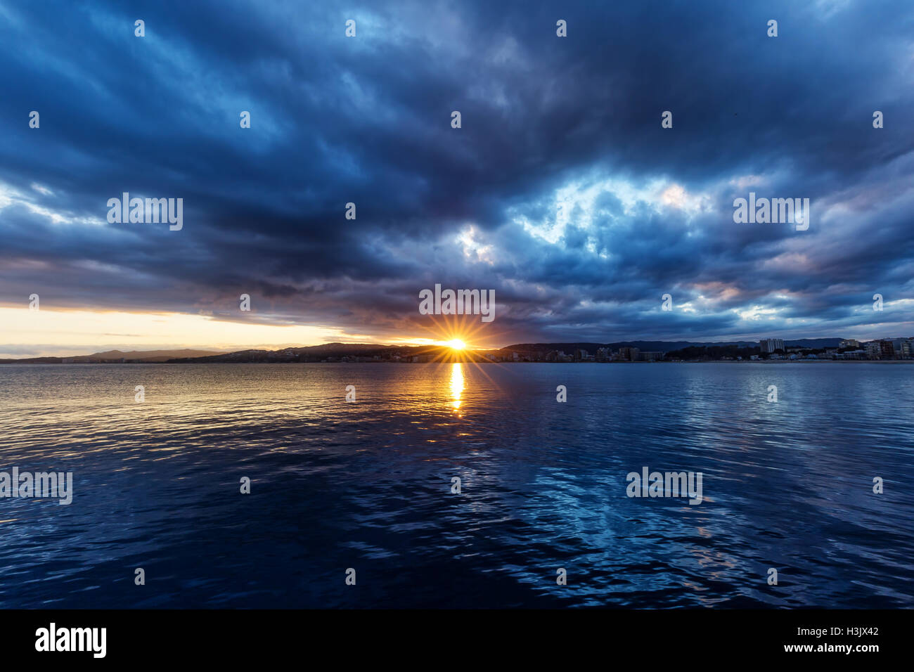 Beautiful sunset over the ocean in Spain Stock Photo - Alamy