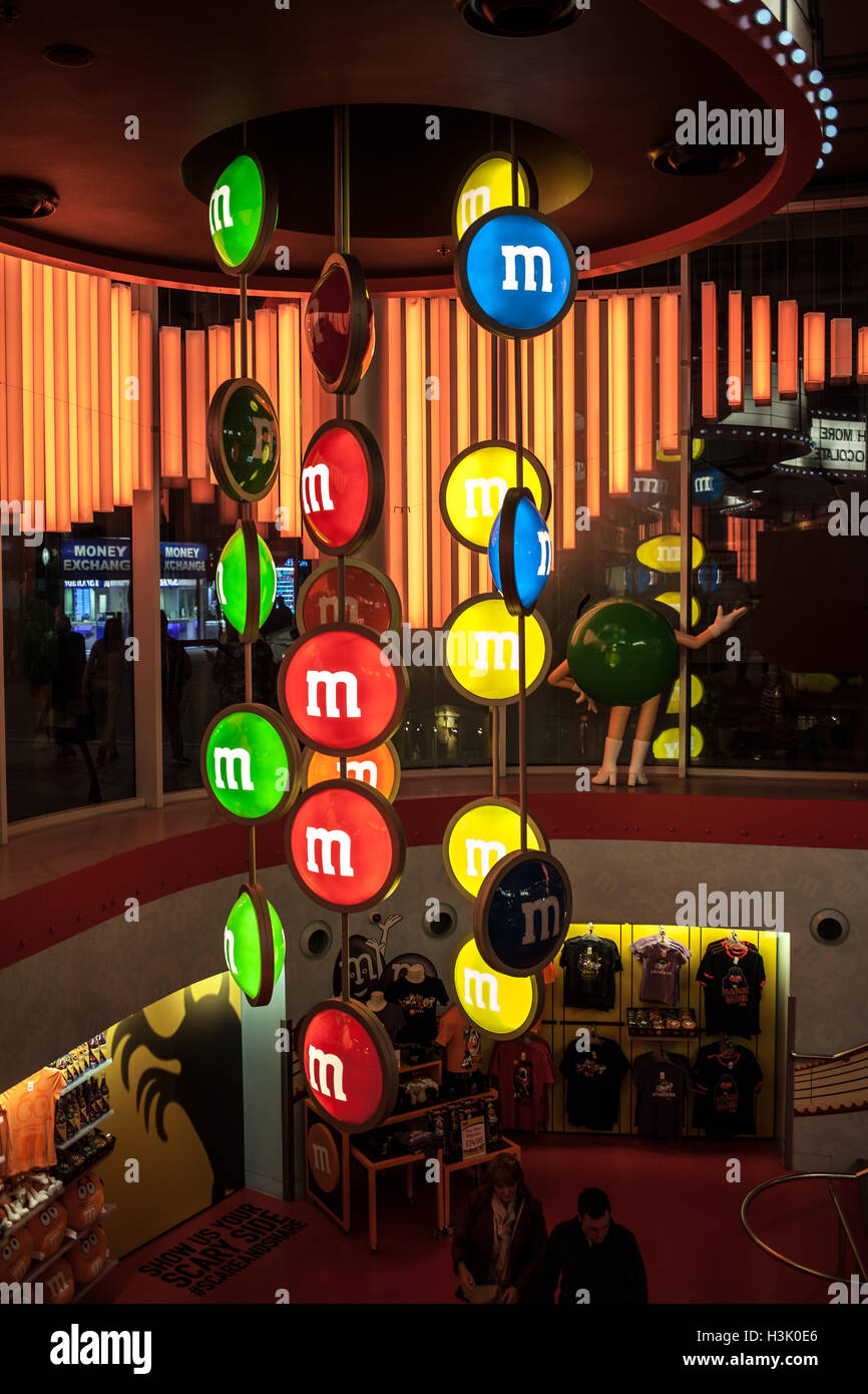 Inside the m&m candy store in London. Big candy M&M hang on the ceiling Stock Photo