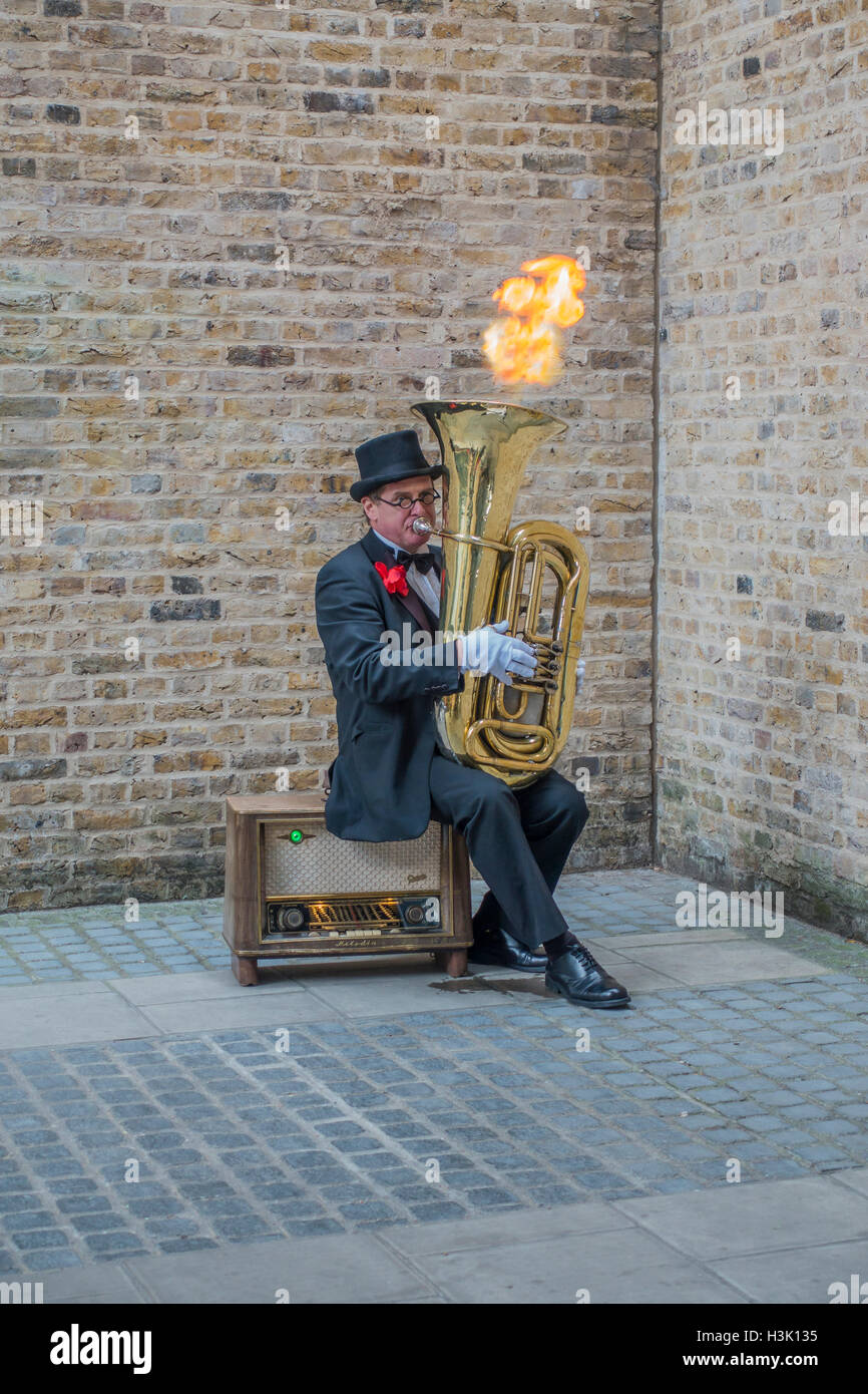 Busker Entertainer with Flaming Tuba South Bank London Stock Photo