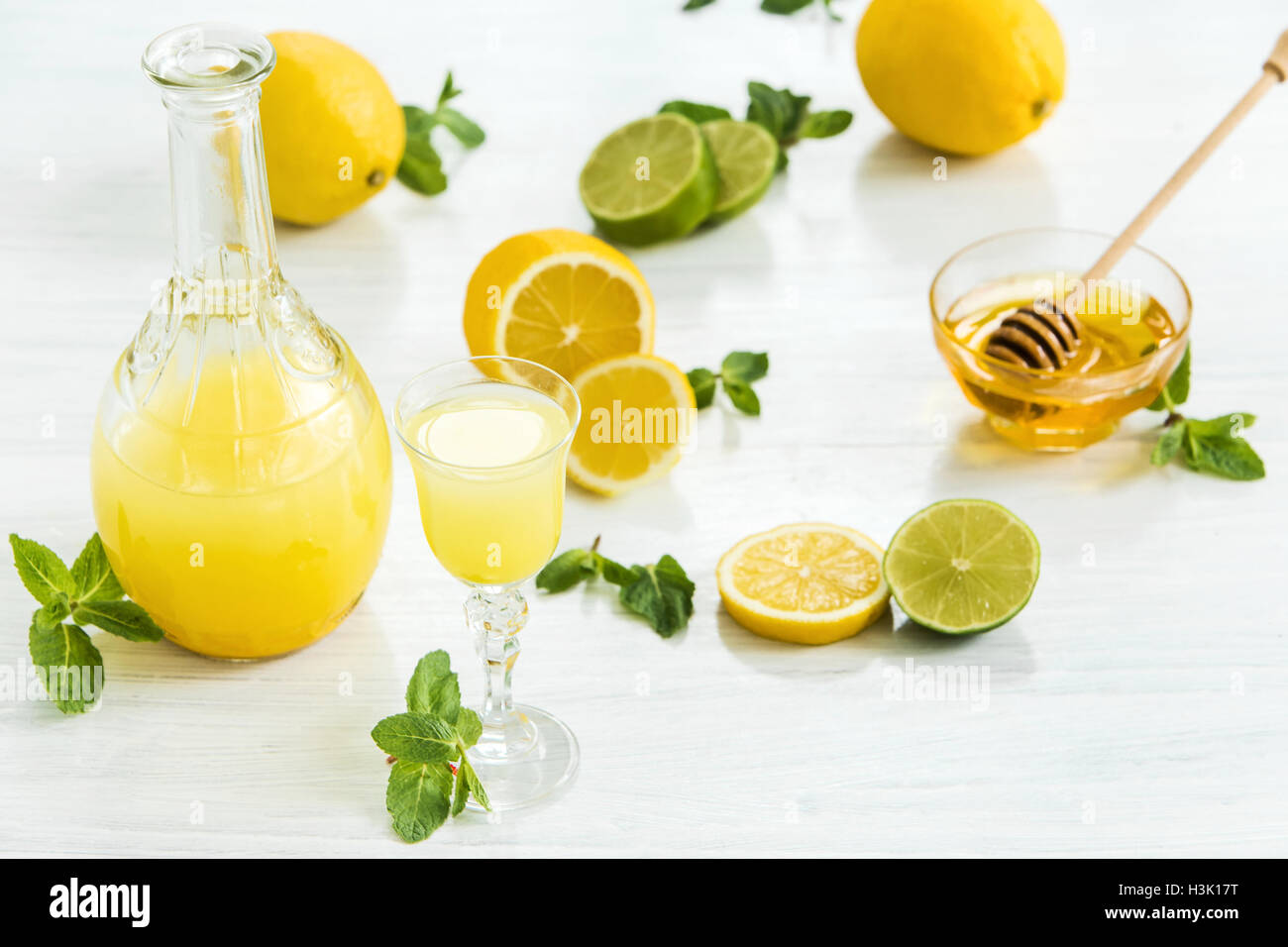 Italian traditional liqueur limoncello with lemon Stock Photo