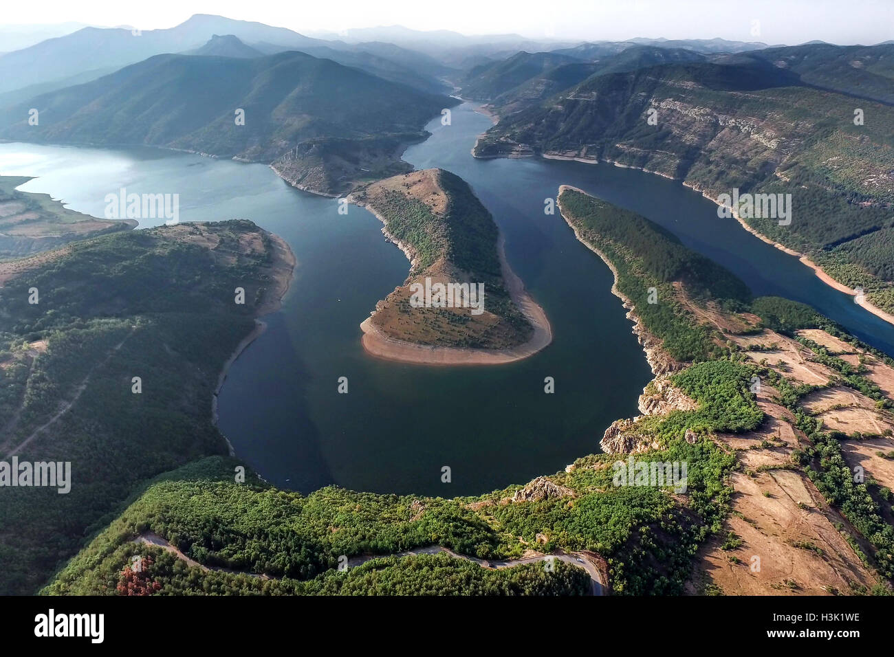 Aerial view panorama of a big mountain river with meanders and country road. Stock Photo