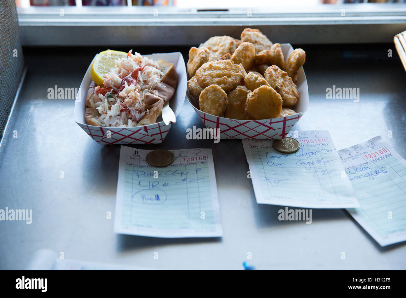 Prepared food by hatch in fast food trailer Stock Photo