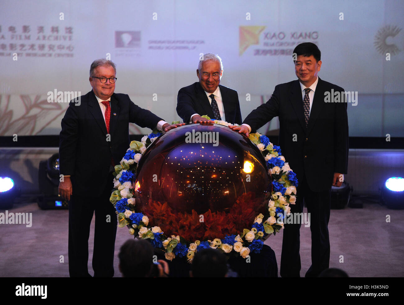 Beijing, China. 9th Oct, 2016. Portuguese Prime Minister Antonio Costa (C) and Tong Gang (R), Deputy Minister of the State Administration of Press, Publication, Radio, Film and Television of China, attend the opening ceremony of China Portugal Cinema Festival in Beijing, capital of China, Oct. 9, 2016. Twenty-four Portuguese films would be showcased during the festival in Beijing and Changsha from Oct. 10 to 30. © Ma Yan/Xinhua/Alamy Live News Stock Photo