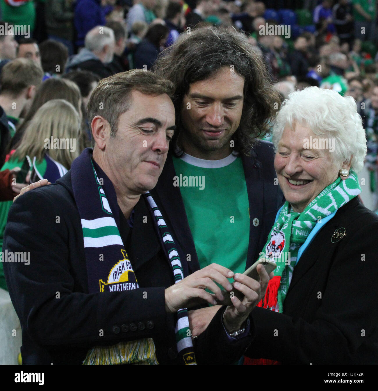 National Football Stadium at Windsor Park, Belfast, Northern Ireland.  08th October 2016. To mark the official opening of the National Football Stadium at Windsor Park in Belfast (the re-development of the old Windsor Park) a Lap of Northern Ireland Legends around the stadium took place. (L-r) Actor Jimmy Nesbitt, Snow Patrol's Gary Lightbody and Dame Mary Peters at the event. David Hunter/Alamy Live News. Stock Photo