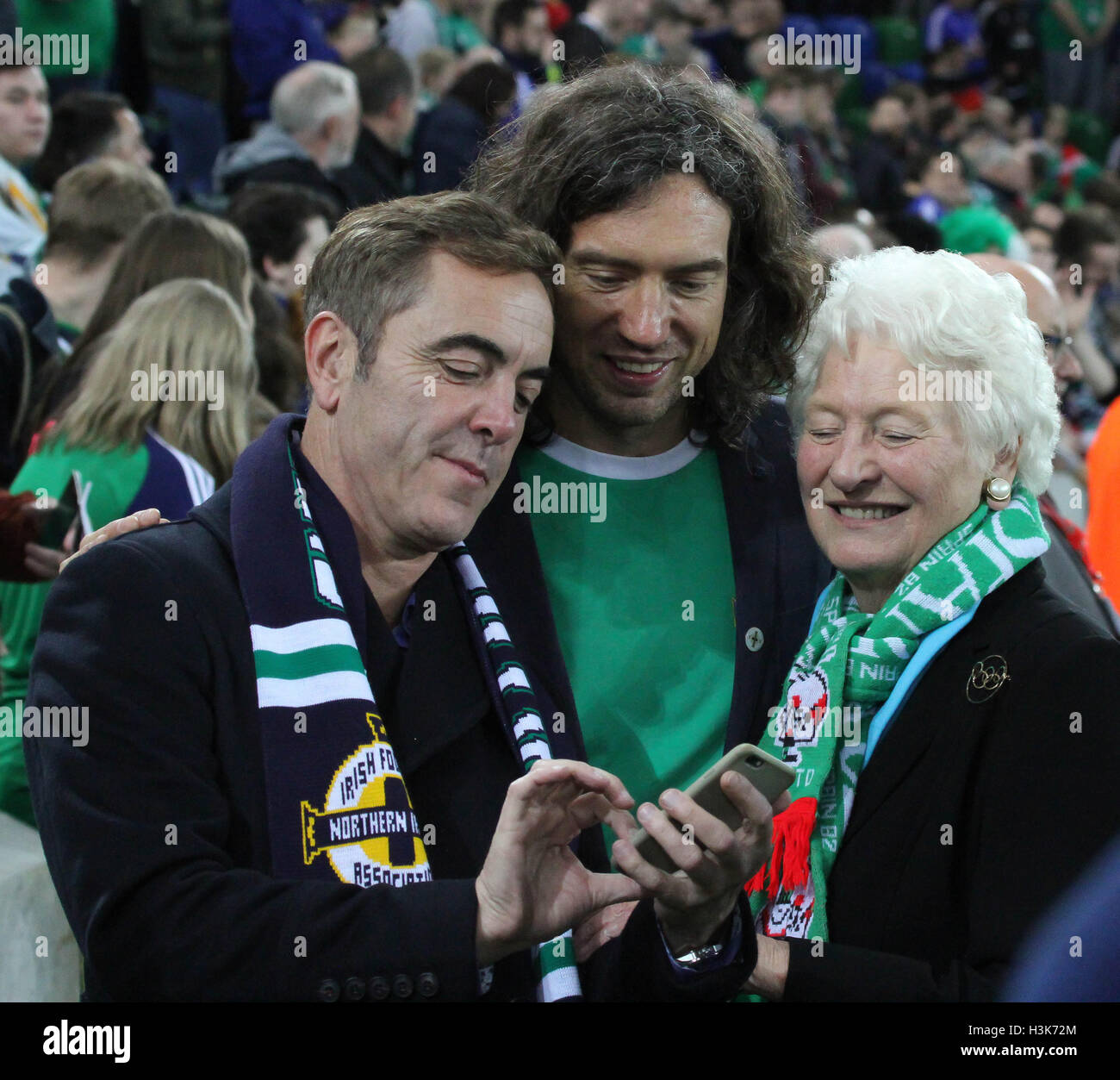 National Football Stadium at Windsor Park, Belfast, Northern Ireland.  08th October 2016. To mark the official opening of the National Football Stadium at Windsor Park in Belfast (the re-development of the old Windsor Park) a Lap of Northern Ireland Legends around the stadium took place. (L-r) Actor Jimmy Nesbitt, Snow Patrol's Gary Lightbody and Dame Mary Peters at the event. David Hunter/Alamy Live News. Stock Photo