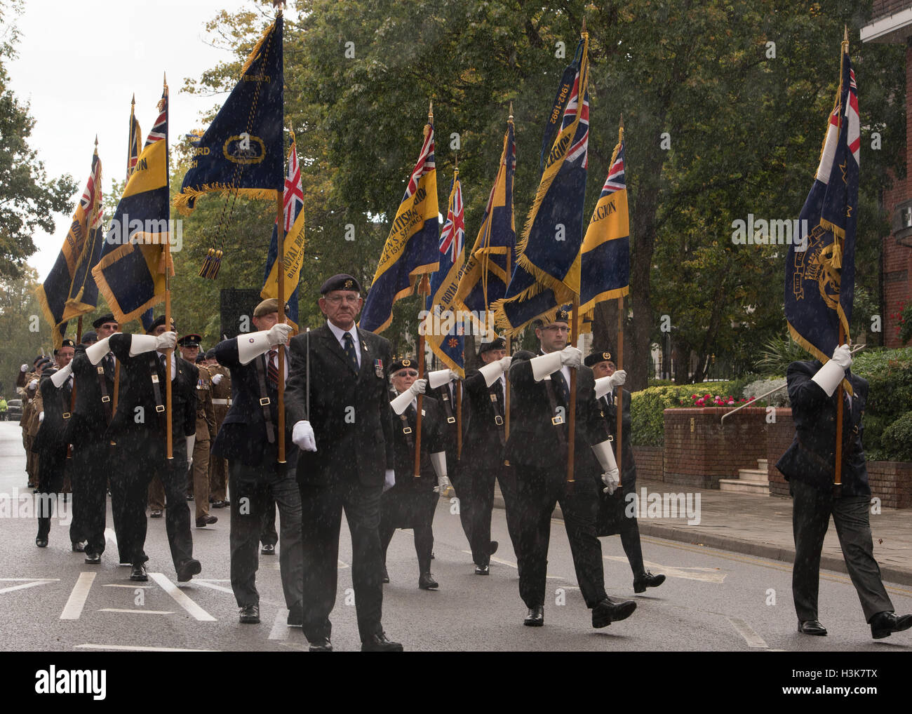 Brentwood, Essex, 9th October 2016, Royal British Legion Standards leads 124 Transport Squadron for a Freedom of Entry march in Brentwood, Essex with heavy rain Credit:  Ian Davidson/Alamy Live News Stock Photo