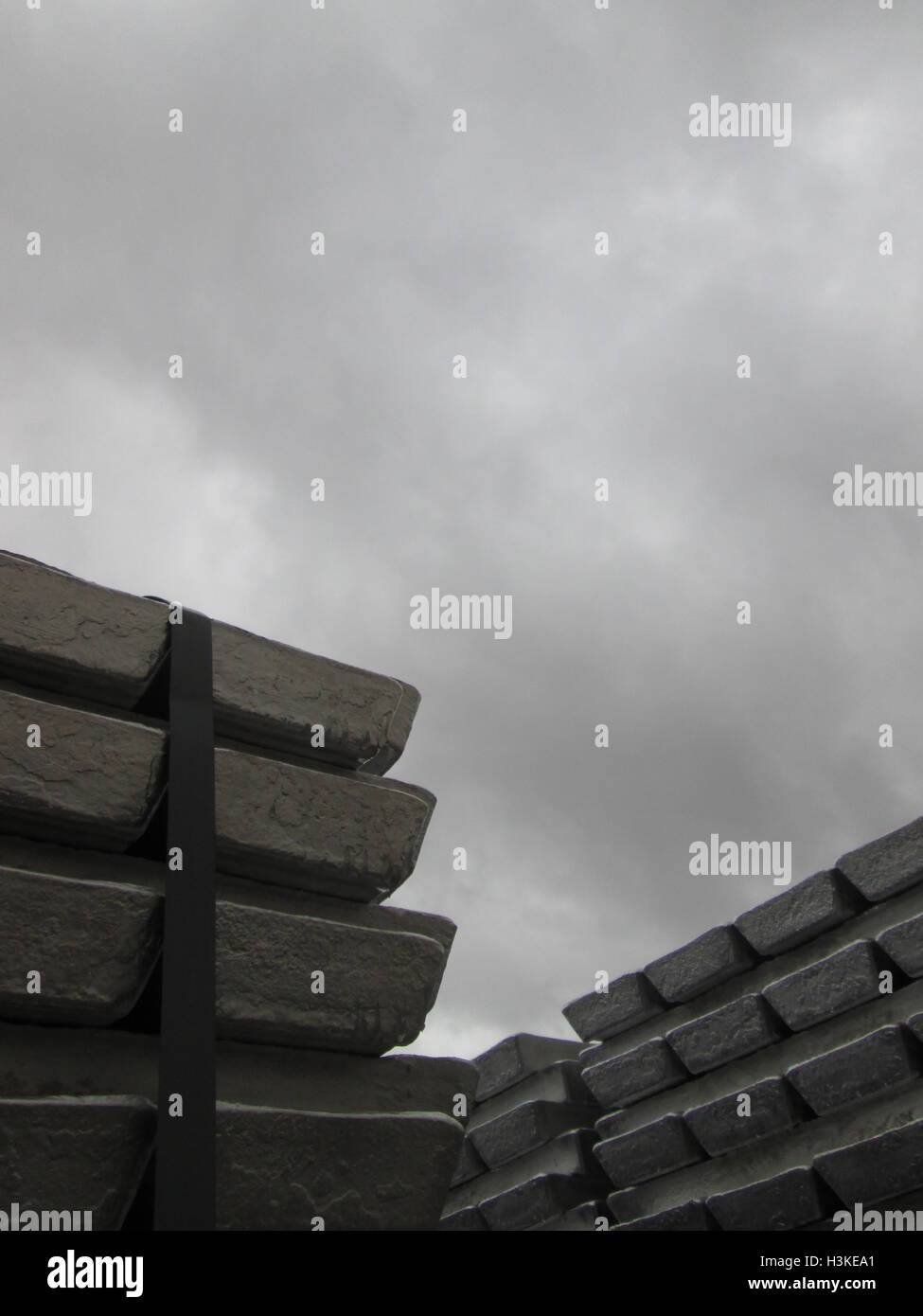 Puerto Ordaz, Venezuela, 10 October 2016.  Weather in Venezuela. Fully it dawned cloudy day in the city this South American country. This image shows a stack of several aluminum ingots produced in an aluminum reduction plant, these companies are mostly in this area of the country, on the photo completely gray sky in the background can be seen. Jorgeprz / Alamy Live News. Stock Photo